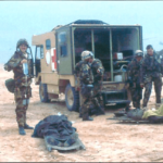 Impromptu casualty care at an exchange point pending air evacuation, South West Iraq, 26th February 1991